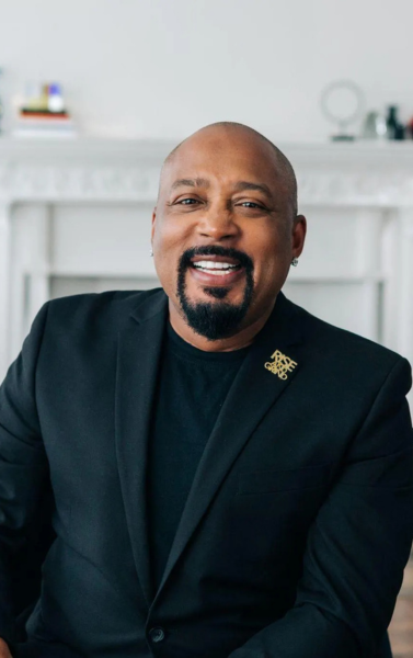 Daymond John, entrepreneur and media personality, featured on the Victor Group services main page representing business expertise and innovation.